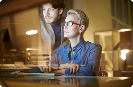 Professionals collaborating at computer
